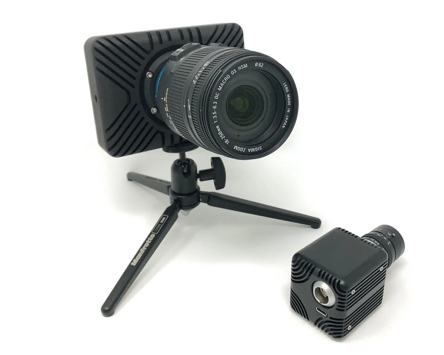 Two HSCAM STREAMER camera housing variants photographed together in a studio.